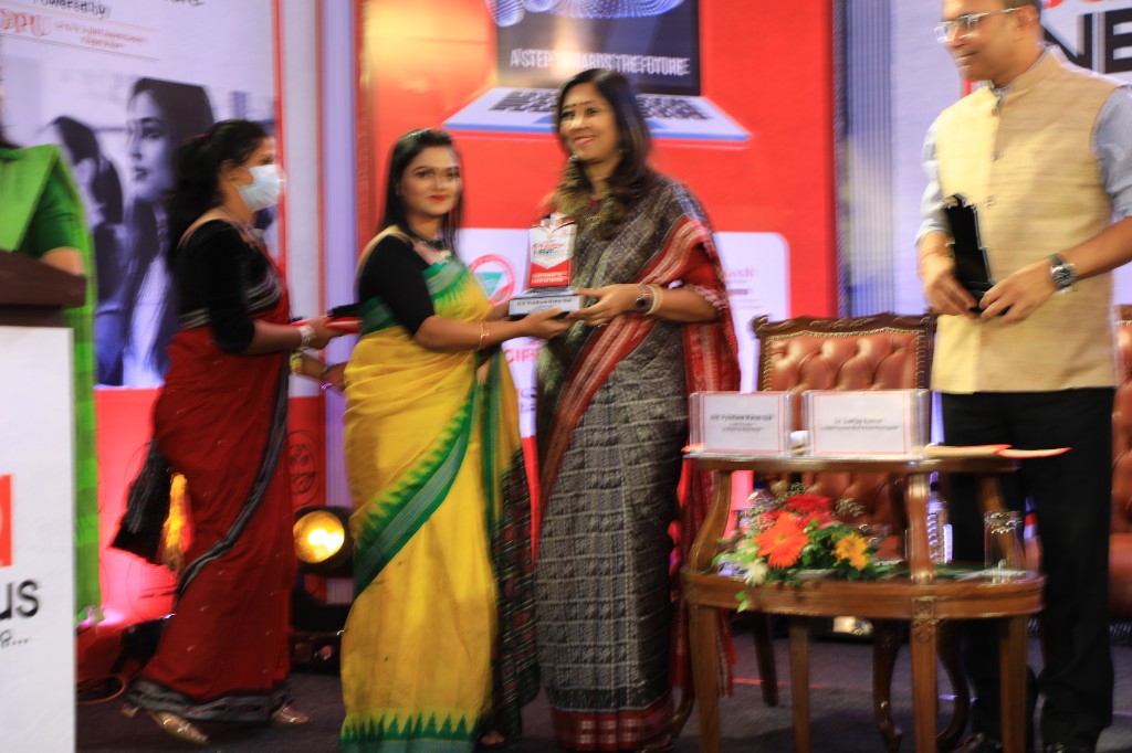 Award presentation on stage at Argus Education Next