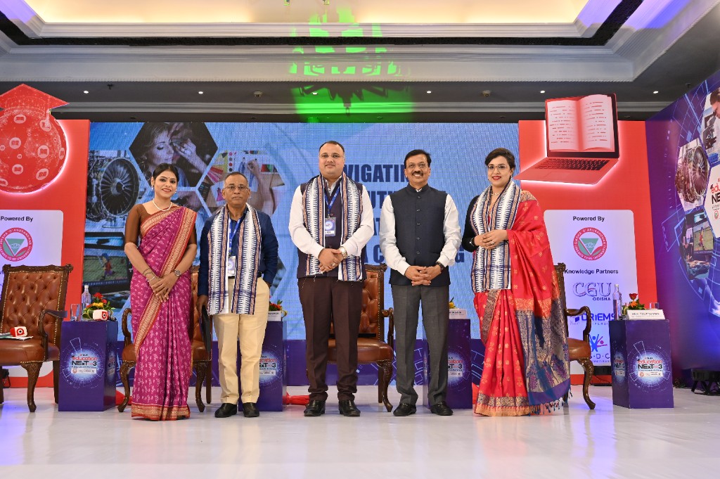 Dignitaries posing on stage with Education Next Season 3 branded podiums