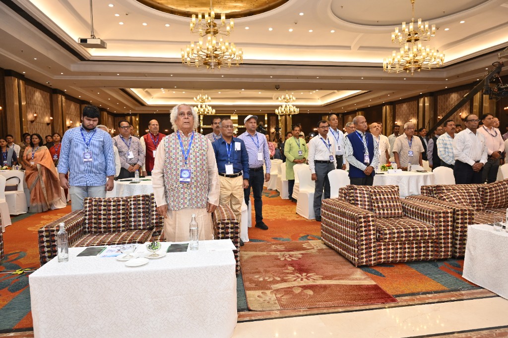 Attendees standing during a formal Season 3 session in the hall